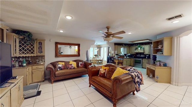 living room featuring recessed lighting, visible vents, a ceiling fan, and light tile patterned flooring