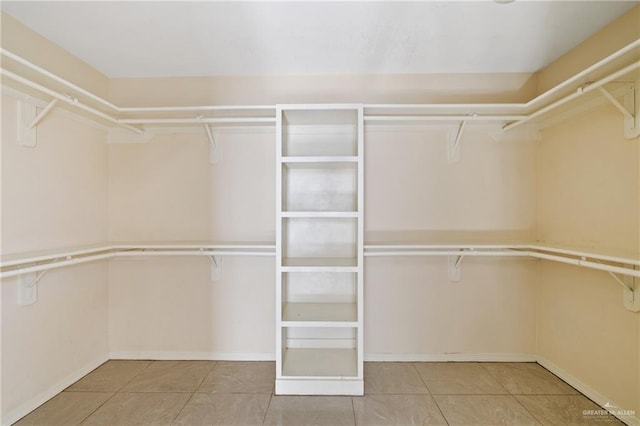 spacious closet featuring tile patterned floors