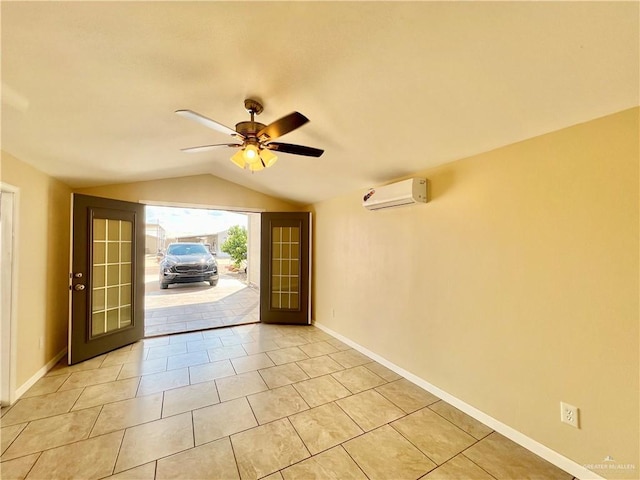 interior space featuring a wall unit AC, ceiling fan, french doors, and vaulted ceiling