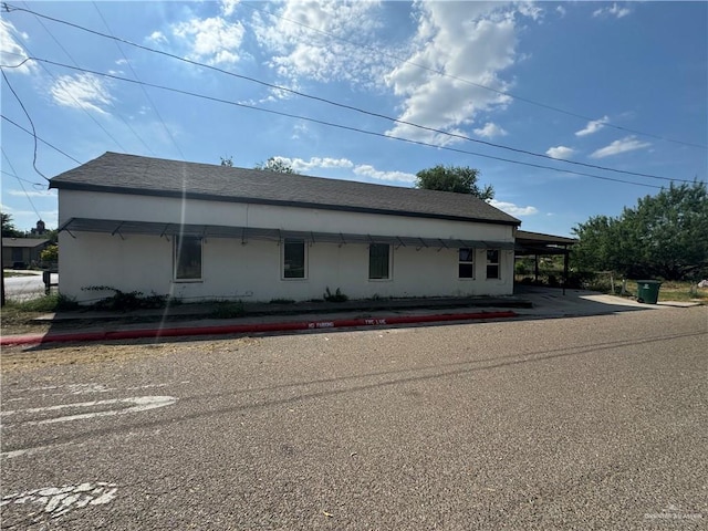 view of front of home featuring a carport