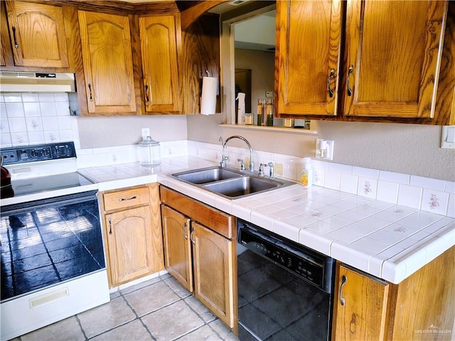 6213 N 17th St, Mcallen, TX 78504 - kitchen with black dishwasher, electric range oven, under cabinet range hood, a sink, and tasteful backsplash