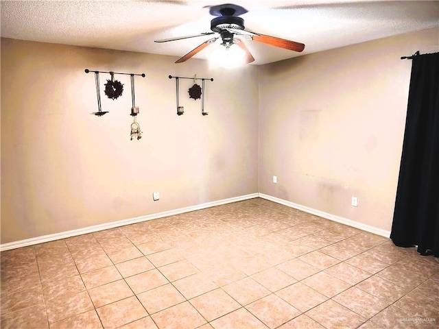 6213 N 17th St, Mcallen, TX 78504 - spare room featuring ceiling fan, light tile patterned floors, a textured ceiling, and baseboards