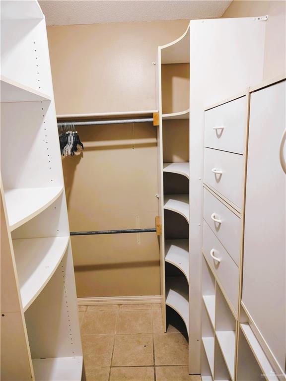 6213 N 17th St, Mcallen, TX 78504 - walk in closet with light tile patterned flooring