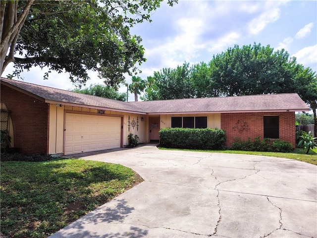 6213 N 17th St, Mcallen, TX 78504 - single story home featuring brick siding, an attached garage, concrete driveway, and a front yard