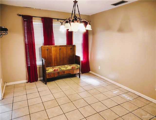 6213 N 17th St, Mcallen, TX 78504 - living area with a chandelier, light tile patterned floors, and baseboards