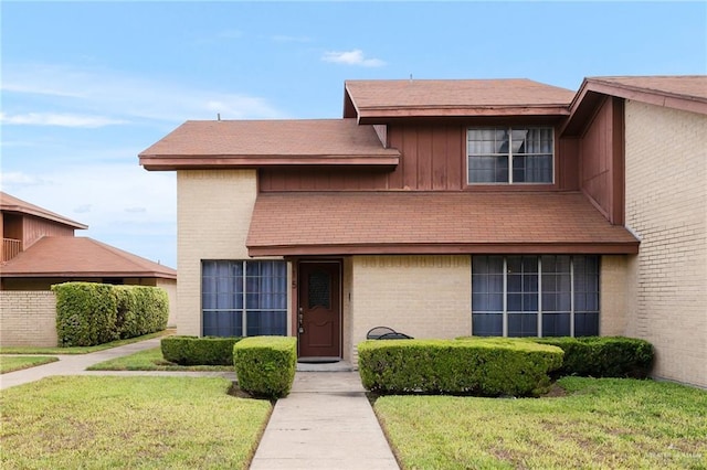 front facade with a front yard