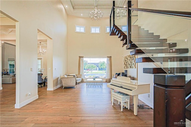 4835 Bryan Rd, Palmhurst, TX 78573 - entryway featuring a chandelier, wood finished floors, recessed lighting, a towering ceiling, and stairway