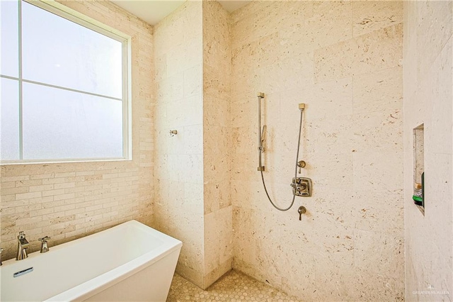 4835 Bryan Rd, Palmhurst, TX 78573 - full bath with a soaking tub, tile walls, and tiled shower