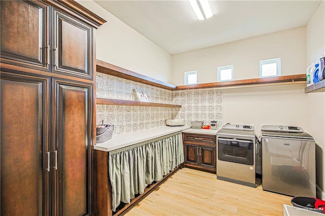 4835 Bryan Rd, Palmhurst, TX 78573 - washroom featuring washing machine and dryer, light wood finished floors, cabinet space, and plenty of natural light