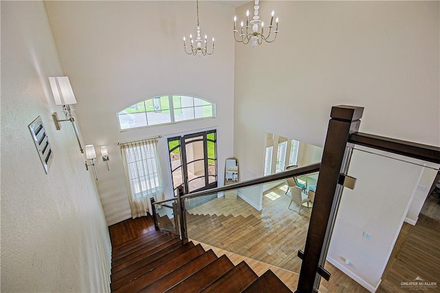 4835 Bryan Rd, Palmhurst, TX 78573 - foyer with wood finished floors, a chandelier, french doors, stairs, and a high ceiling