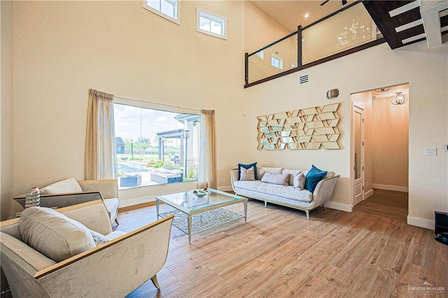 4835 Bryan Rd, Palmhurst, TX 78573 - living area featuring wood finished floors and a high ceiling