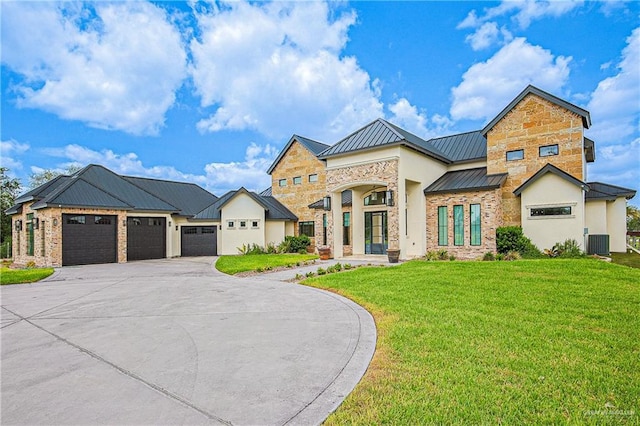 4835 Bryan Rd, Palmhurst, TX 78573 - view of front facade with a standing seam roof, an attached garage, a front lawn, and concrete driveway