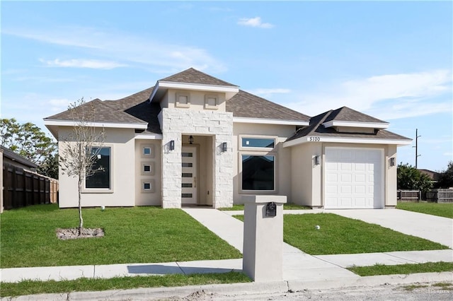 prairie-style house with a front yard and a garage