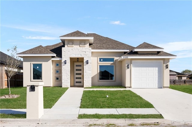 prairie-style house with a front lawn and a garage