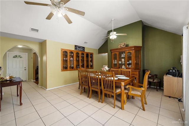 tiled dining room featuring ceiling fan and lofted ceiling