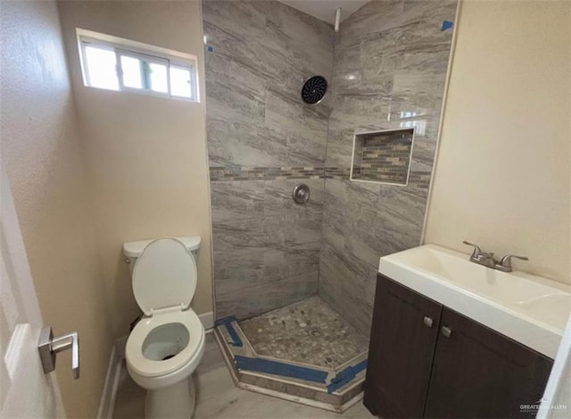 2505 W Bella Vista Ave W, Alton, TX 78573 - full bathroom featuring a stall shower, toilet, and vanity