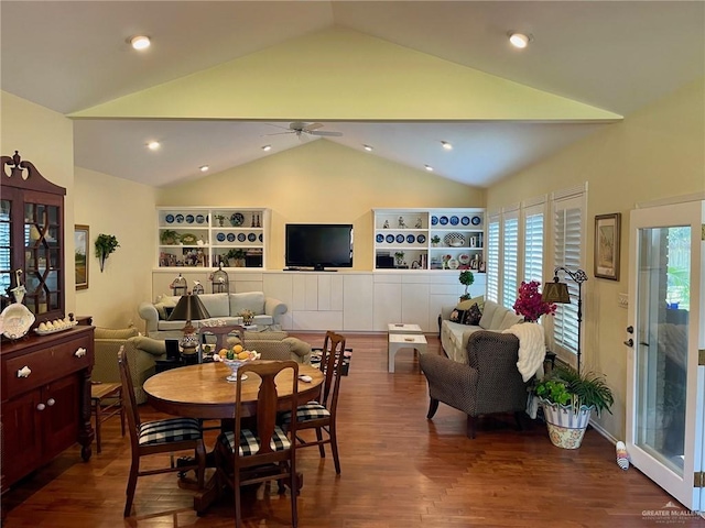 dining area featuring lofted ceiling, wood-type flooring, and ceiling fan