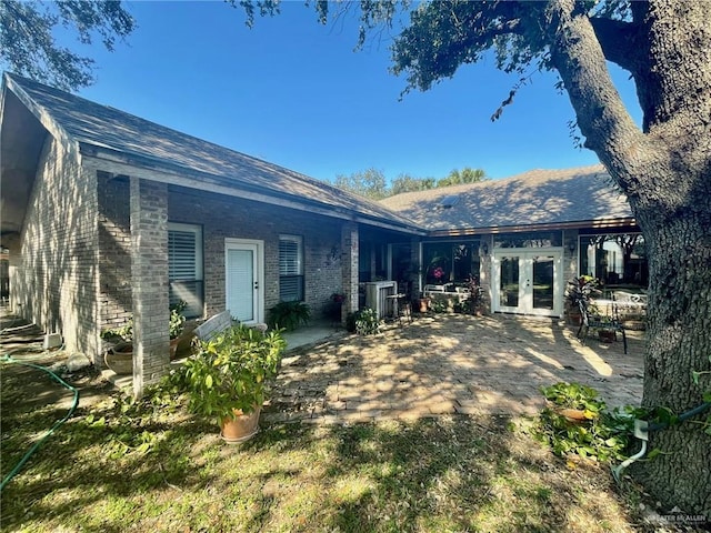 back of house featuring a patio and french doors