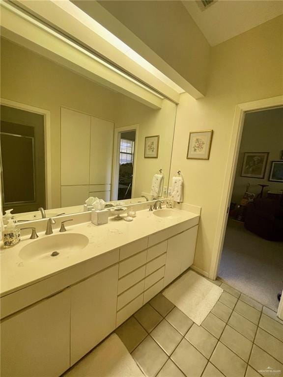 bathroom with tile patterned flooring and vanity