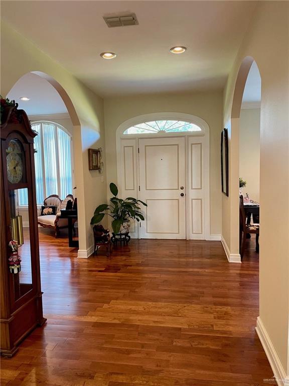 entryway with dark hardwood / wood-style flooring