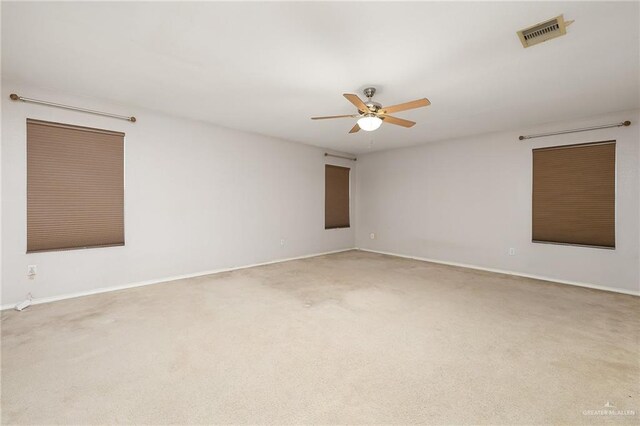 3838 View Point Dr, Edinburg, TX 78542 - carpeted spare room with baseboards, visible vents, and ceiling fan
