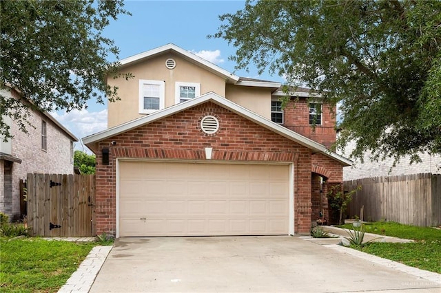 3838 View Point Dr, Edinburg, TX 78542 - traditional home featuring brick siding, an attached garage, concrete driveway, and fence