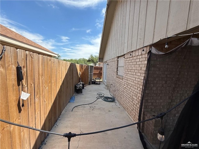 view of property exterior with a patio