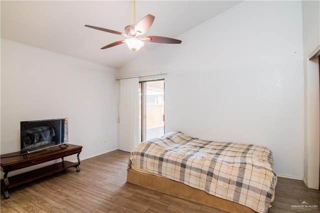 bedroom featuring ceiling fan, vaulted ceiling, and hardwood / wood-style floors