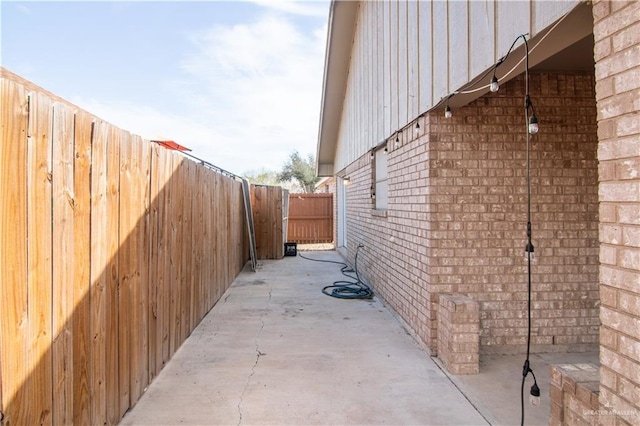 view of property exterior with a patio