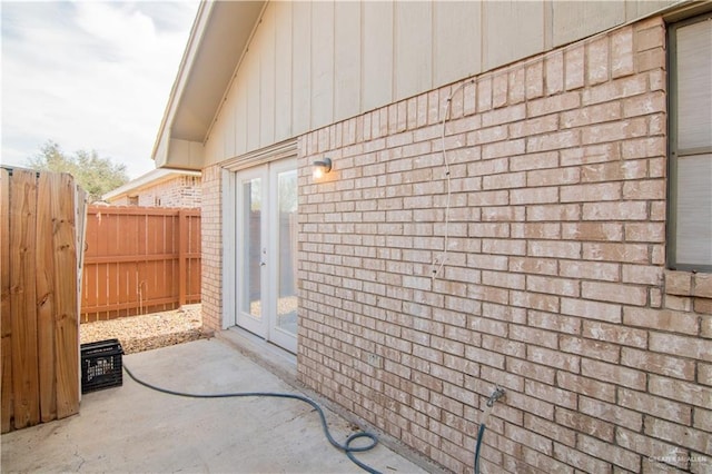 view of side of home with a patio area and french doors