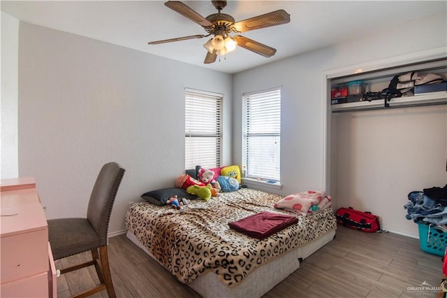 bedroom featuring a closet, ceiling fan, and wood-type flooring