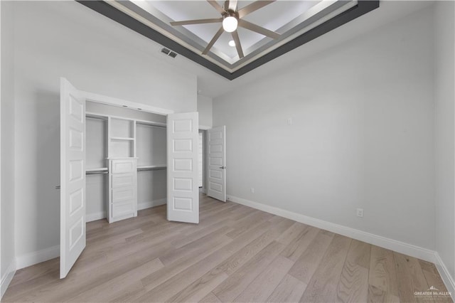 1405 Helen Dr, Weslaco, TX 78599 - unfurnished bedroom with light wood-type flooring, a closet, and baseboards