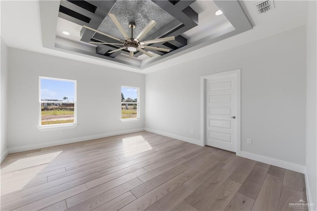 1405 Helen Dr, Weslaco, TX 78599 - unfurnished room with a tray ceiling, light wood finished floors, a ceiling fan, baseboards, and recessed lighting