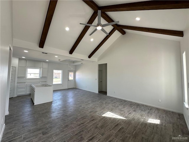 unfurnished living room featuring baseboards, dark wood finished floors, beam ceiling, high vaulted ceiling, and a ceiling fan