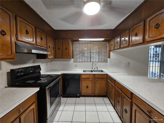 905 E Ithaca Ave, Mcallen, TX 78501 - kitchen featuring electric range oven, black dishwasher, under cabinet range hood, a sink, and brown cabinetry