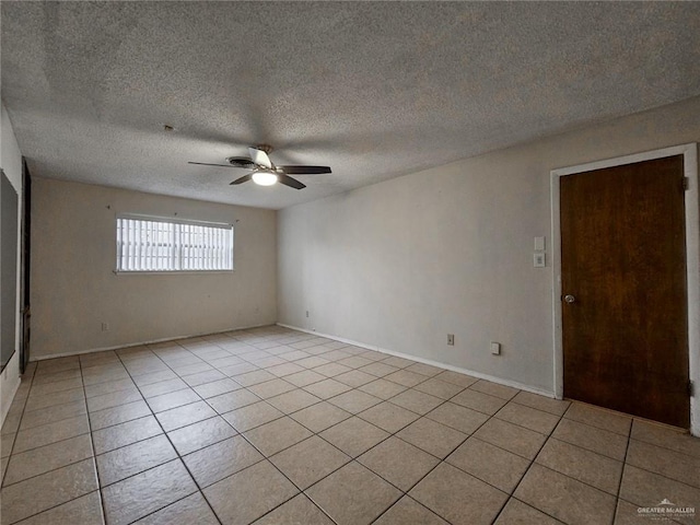 905 E Ithaca Ave, Mcallen, TX 78501 - unfurnished room featuring a ceiling fan, light tile patterned floors, a textured ceiling, and baseboards