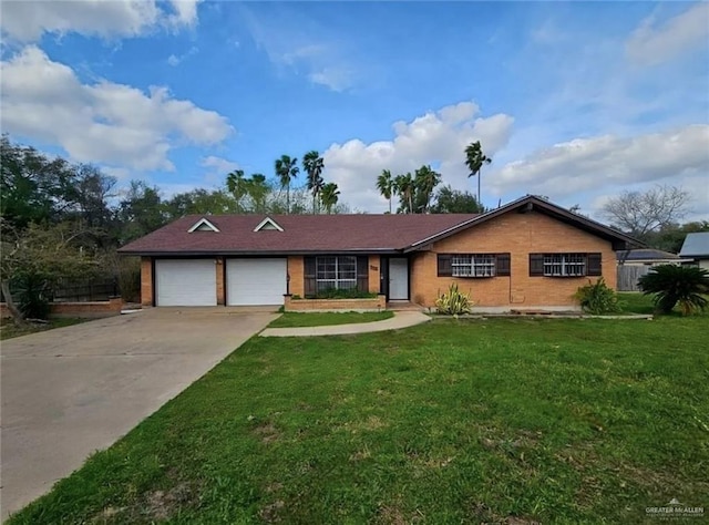 905 E Ithaca Ave, Mcallen, TX 78501 - ranch-style house with a garage, a front yard, driveway, and brick siding