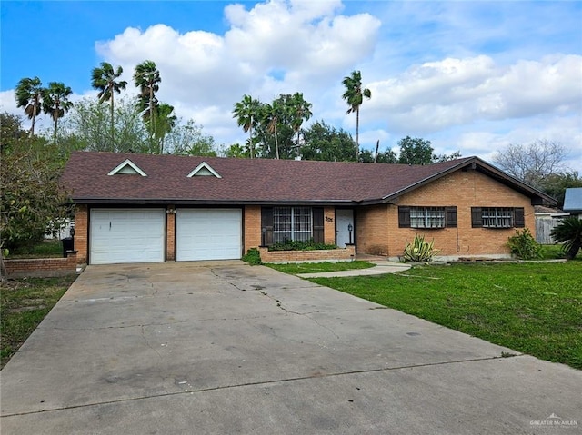 905 E Ithaca Ave, Mcallen, TX 78501 - single story home with brick siding, a front yard, a garage, driveway, and a shingled roof