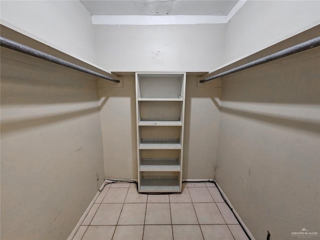905 E Ithaca Ave, Mcallen, TX 78501 - walk in closet with light tile patterned floors