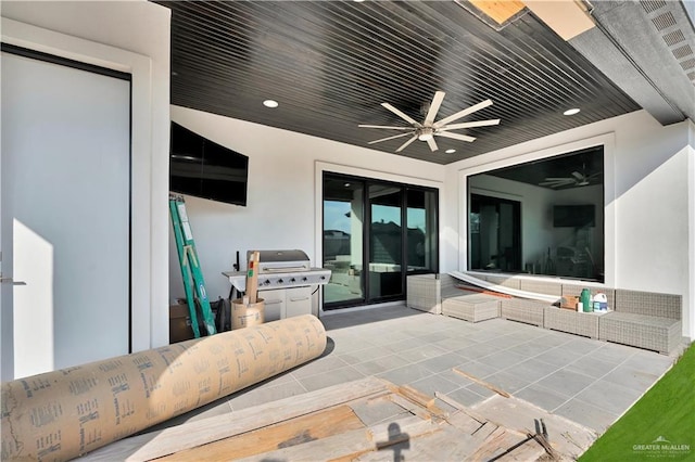 view of patio with grilling area and a ceiling fan