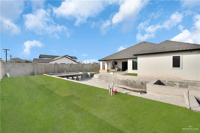 view of yard featuring a patio and a fenced backyard