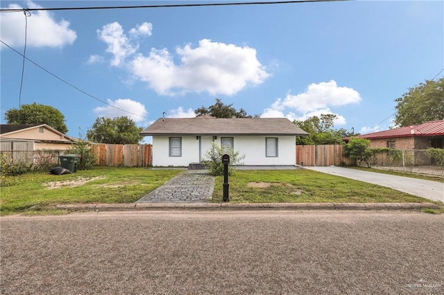 410 W 7th St, San Juan, TX 78589 - ranch-style home with driveway and stucco siding