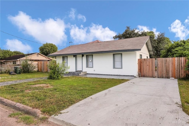 410 W 7th St, San Juan, TX 78589 - single story home featuring stucco siding and driveway
