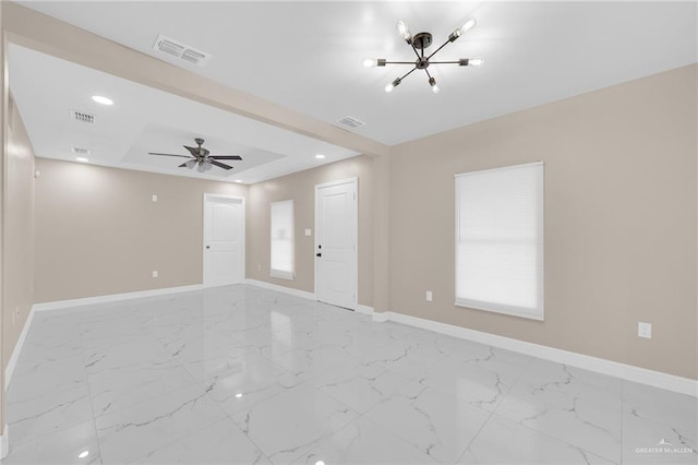 410 W 7th St, San Juan, TX 78589 - unfurnished living room with a chandelier, marble look tile flooring, ceiling fan, recessed lighting, and a tray ceiling