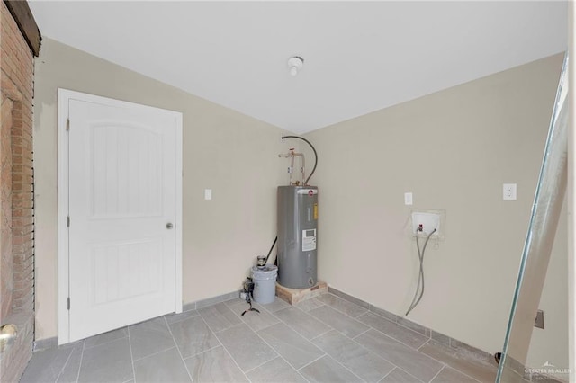 410 W 7th St, San Juan, TX 78589 - utility room featuring electric water heater
