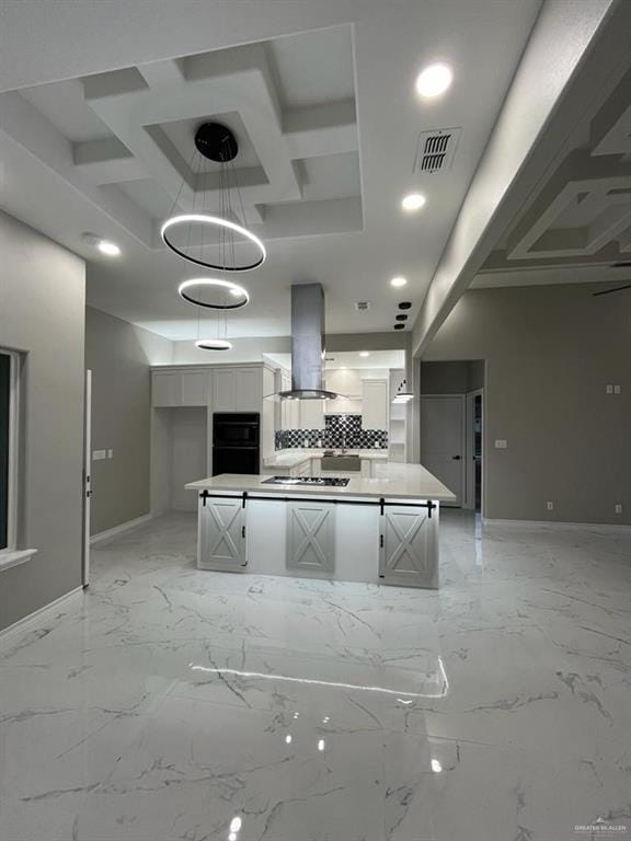 kitchen featuring a kitchen island, island range hood, white cabinetry, oven, and gas cooktop