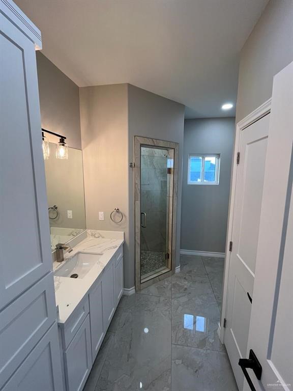 bathroom with vanity and an enclosed shower