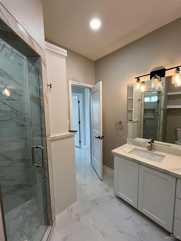 bathroom featuring vanity, toilet, and walk in shower