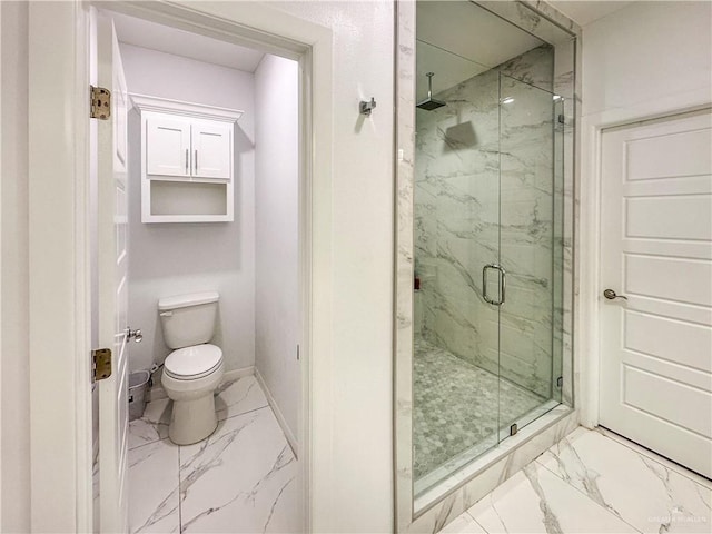 bathroom with a shower with door and toilet