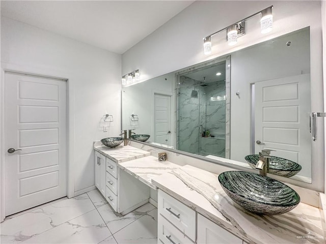 bathroom featuring an enclosed shower and vanity